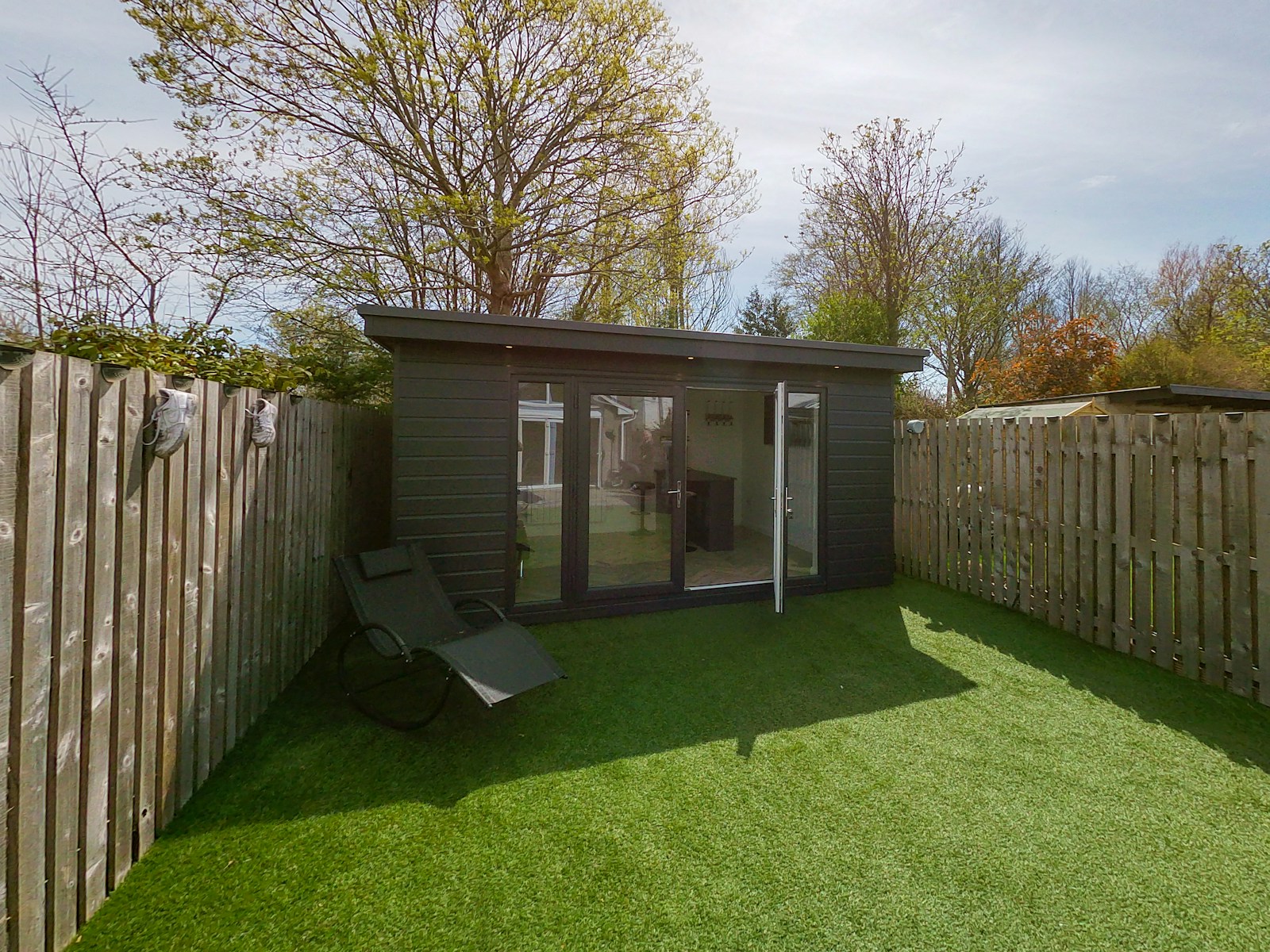 Photo by Steen Builders a small shed in a backyard